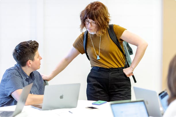 Photo: Colleagues pairing over a problem